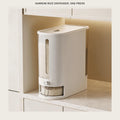 Slim rice dispenser on a pale kitchen counter beside a white cabinet, filled with rice