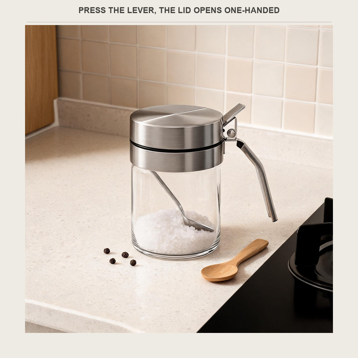 Borosilicate spice jar with a stainless press lid next to the stove
