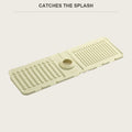 Beige silicone faucet mat laid flat, drain hole and ridged surface visible