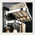 304 stainless folding towel shelf on a bathroom wall holding folded towels