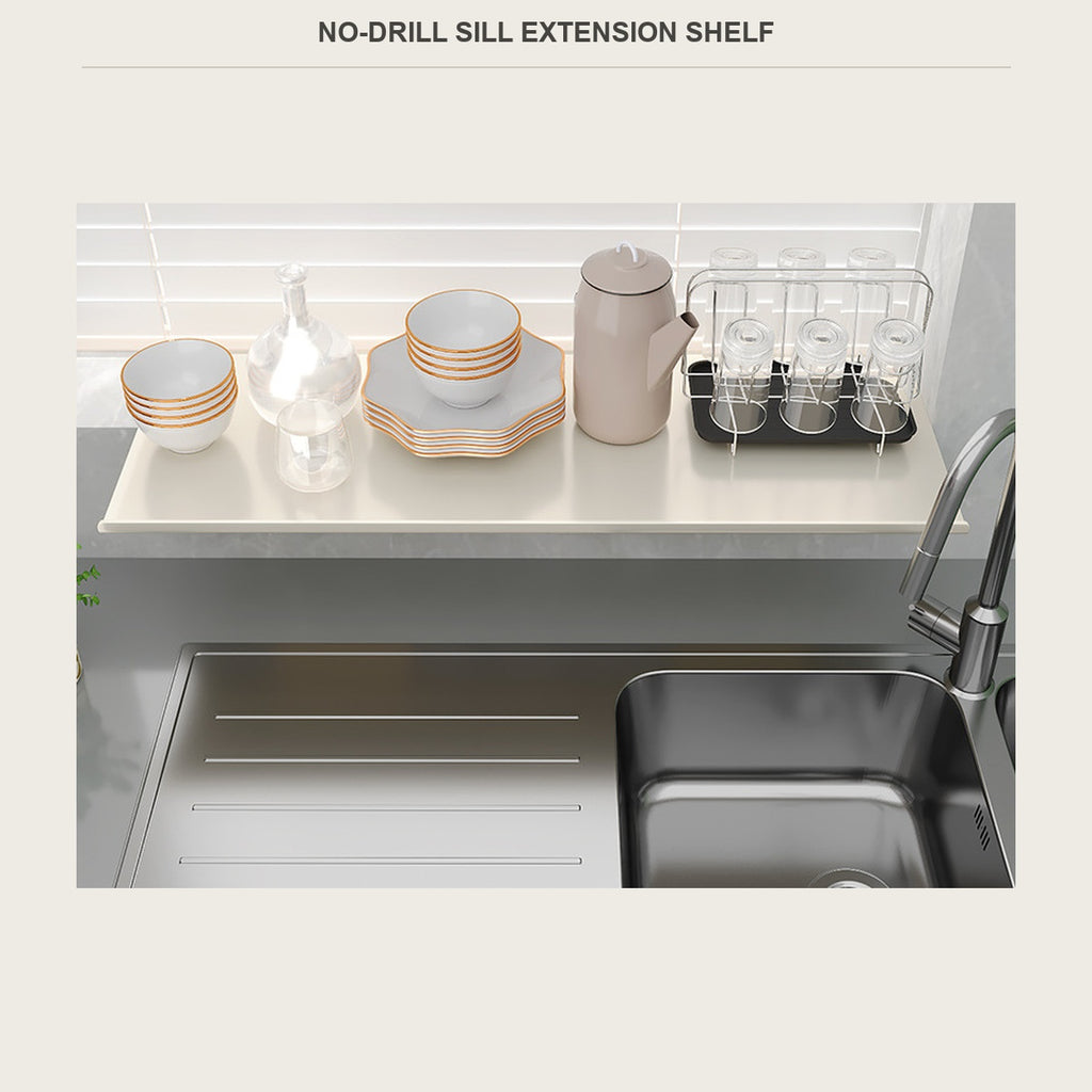 No-drill sill extension shelf on a kitchen windowsill above the sink, holding bowls and a kettle