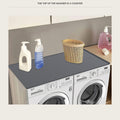 Non slip mat laid across the top of a washer and dryer side by side