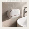 Wall soap dish box mounted on a marble bathroom wall beside a basin