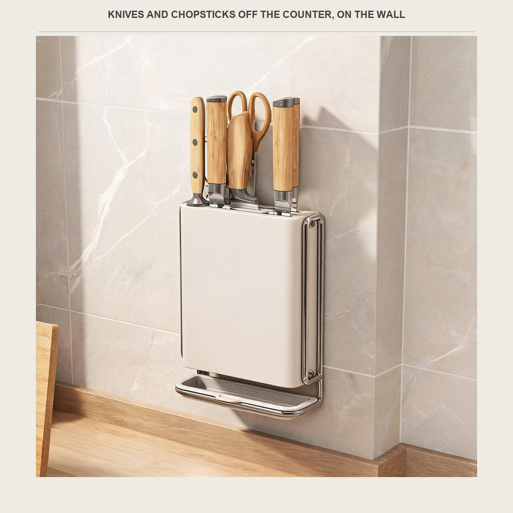 Cream white wall mounted utensil holder on a beige tile wall holding knives and a pair of scissors