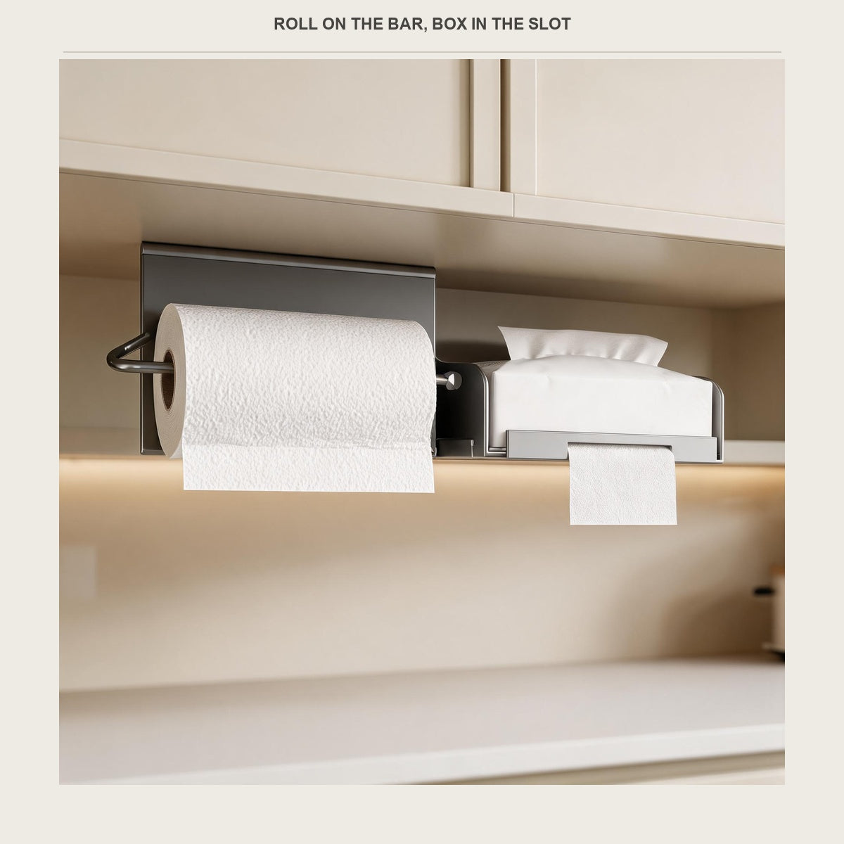 The paper holder under a cabinet with a box of tissues in the front opening and a roll on the side bar
