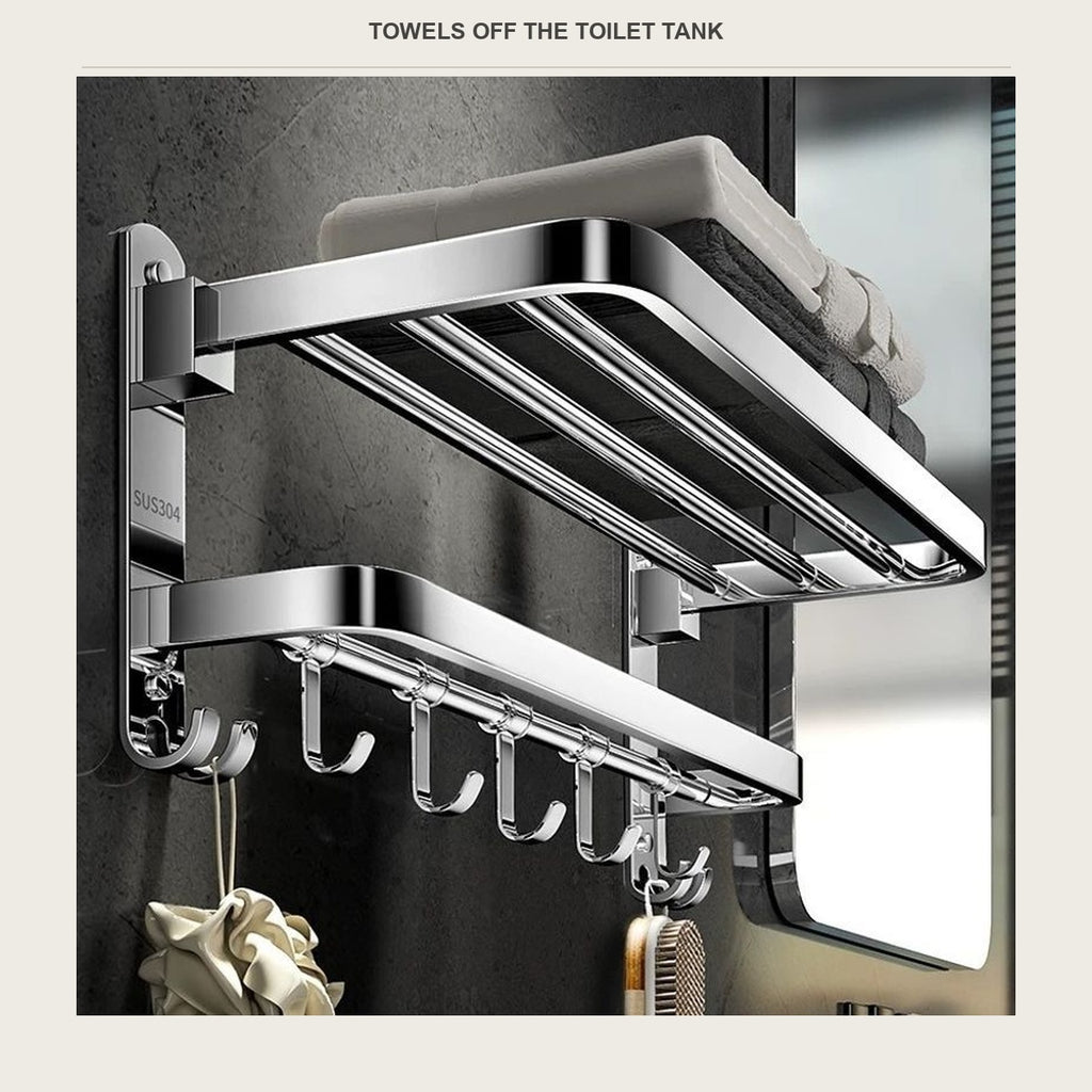 Hand placing a folded towel on the two tier stainless towel shelf