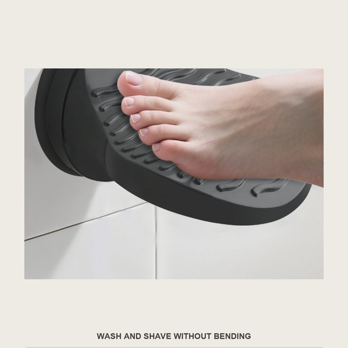 Foot resting on the black shower foot rest while washing in the shower