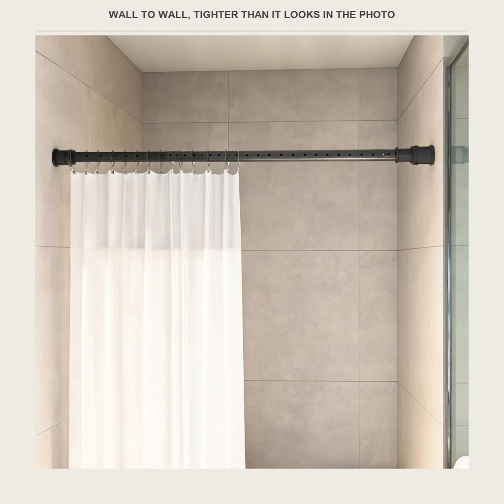 The tension rod across a shower opening with a white sheer curtain