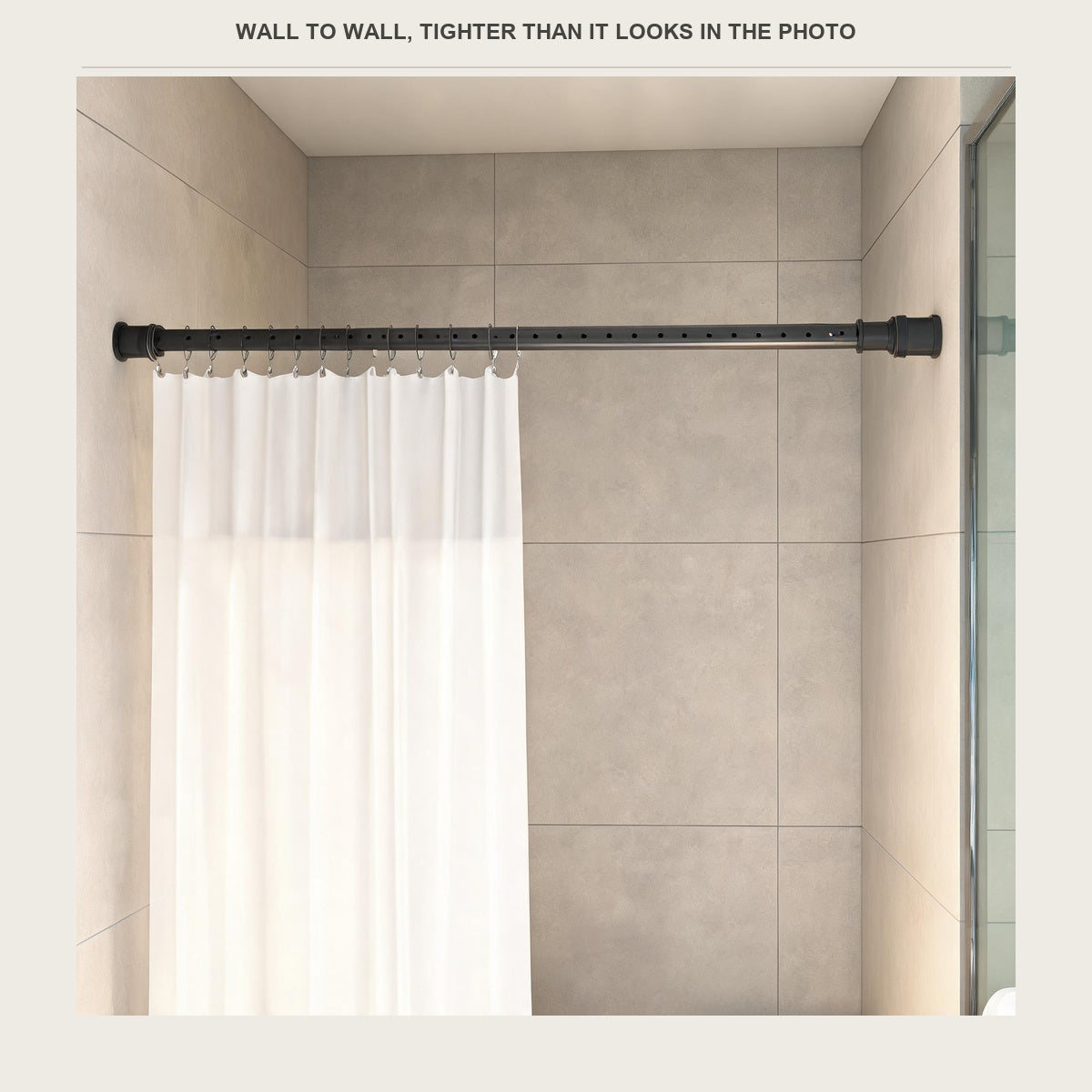 The tension rod across a shower opening with a white sheer curtain