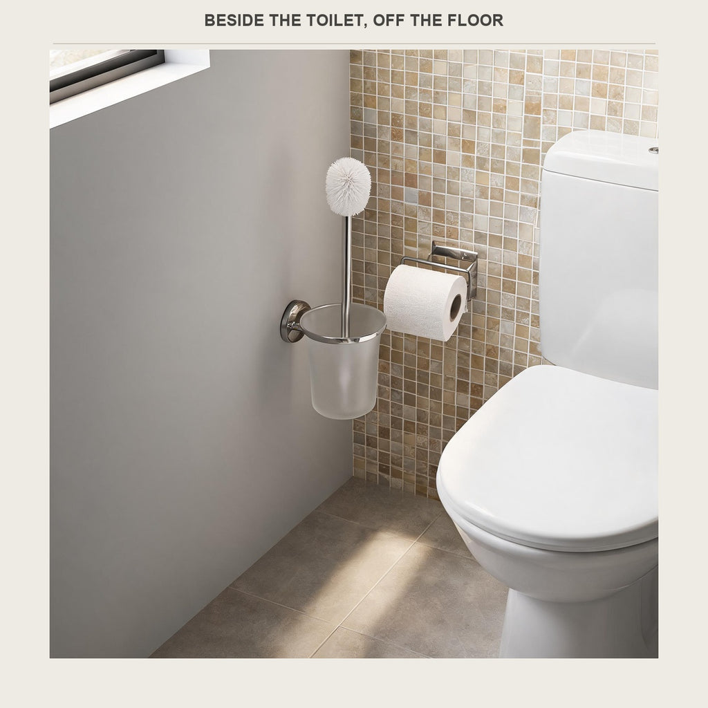 The brush holder mounted low on the wall next to the toilet