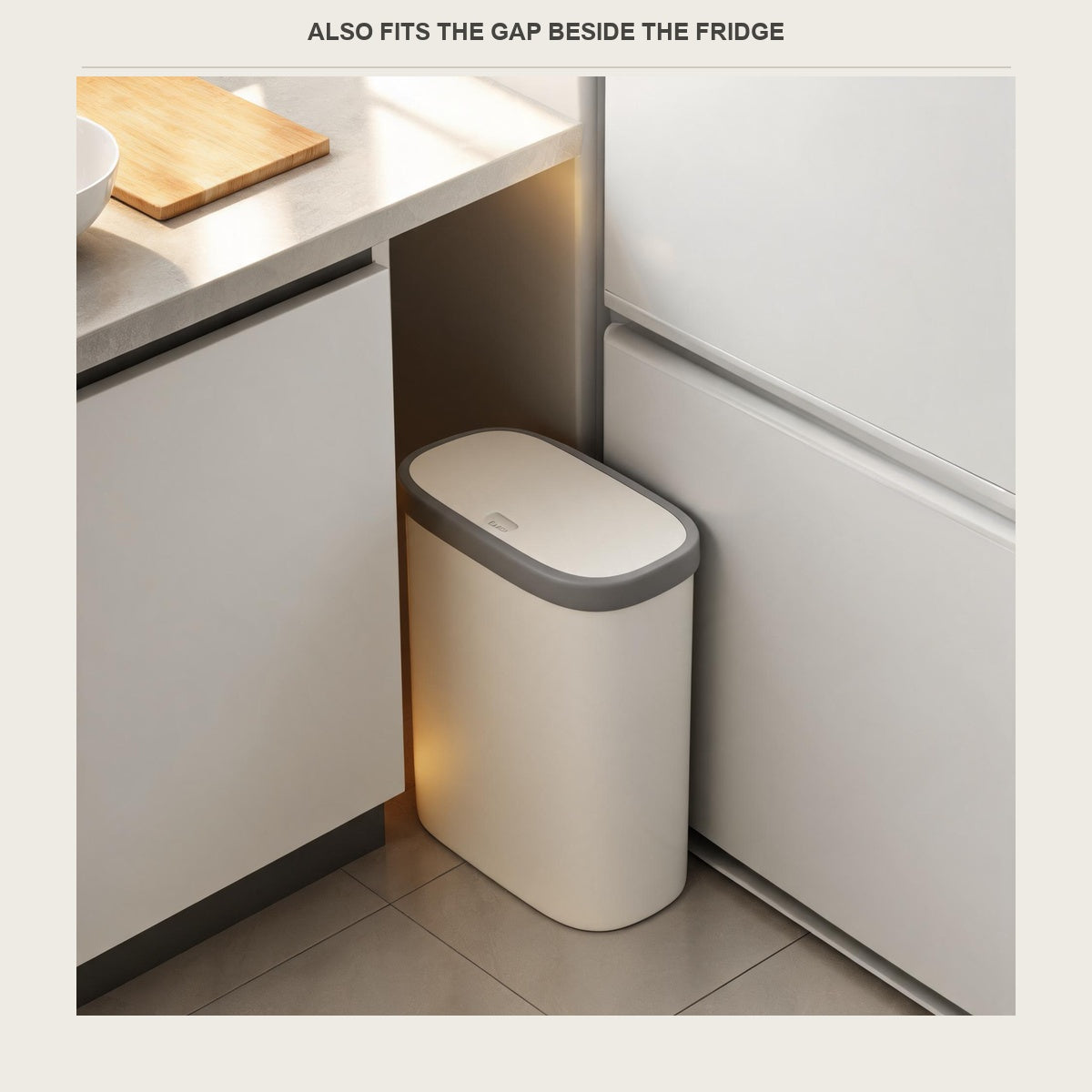 The slim bin pushed into the gap between a kitchen cabinet and the side of a fridge