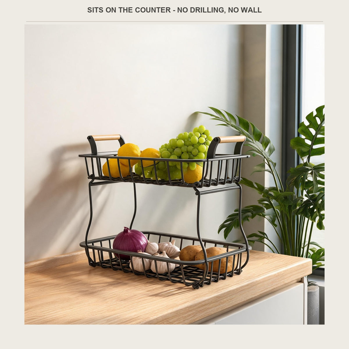 Fruit rack on a sideboard with lemons and grapes above, onions and garlic below
