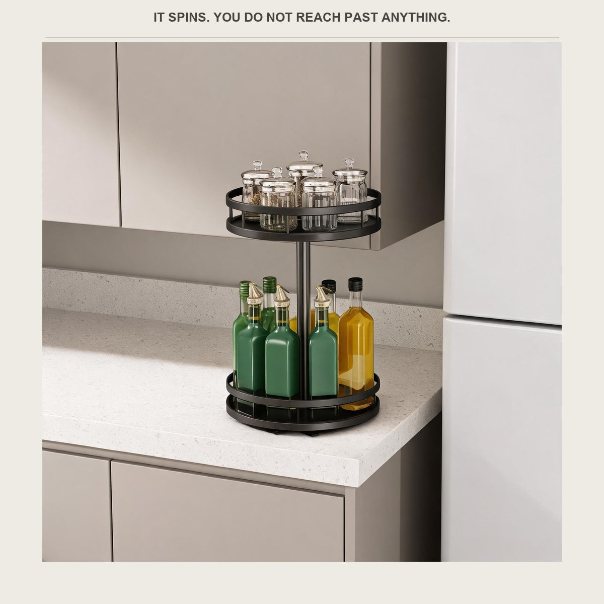 The rotating spice rack on a narrow counter between a cabinet and a fridge