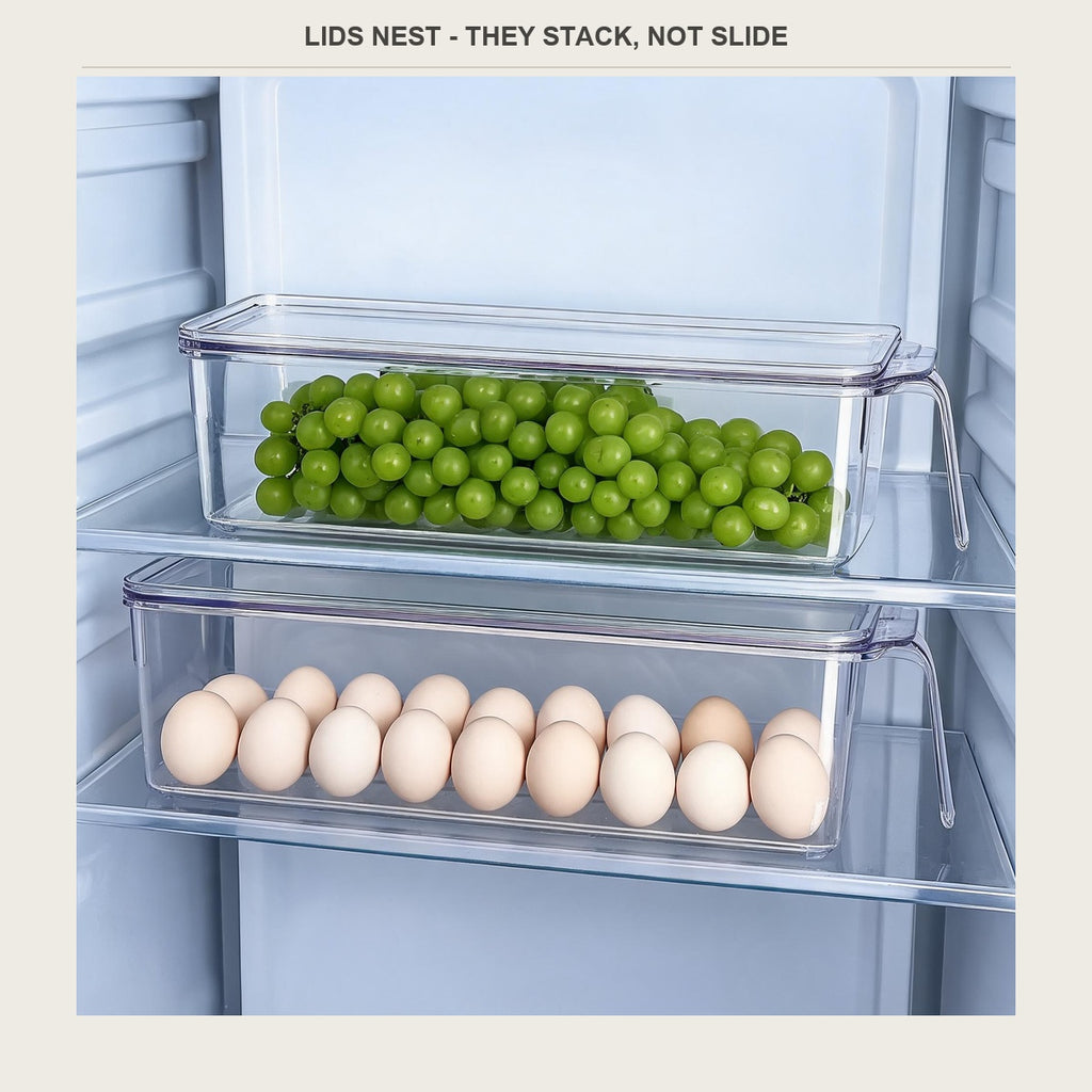 Two clear bins stacked on a fridge shelf, one with grapes and one with eggs