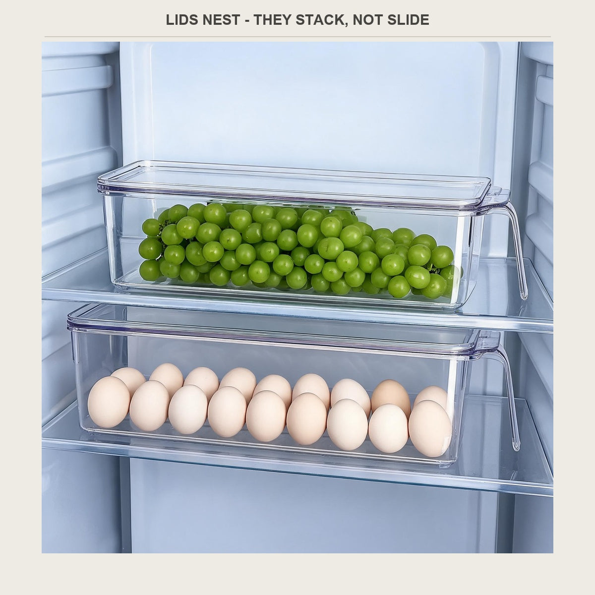 Two clear bins stacked on a fridge shelf, one with grapes and one with eggs