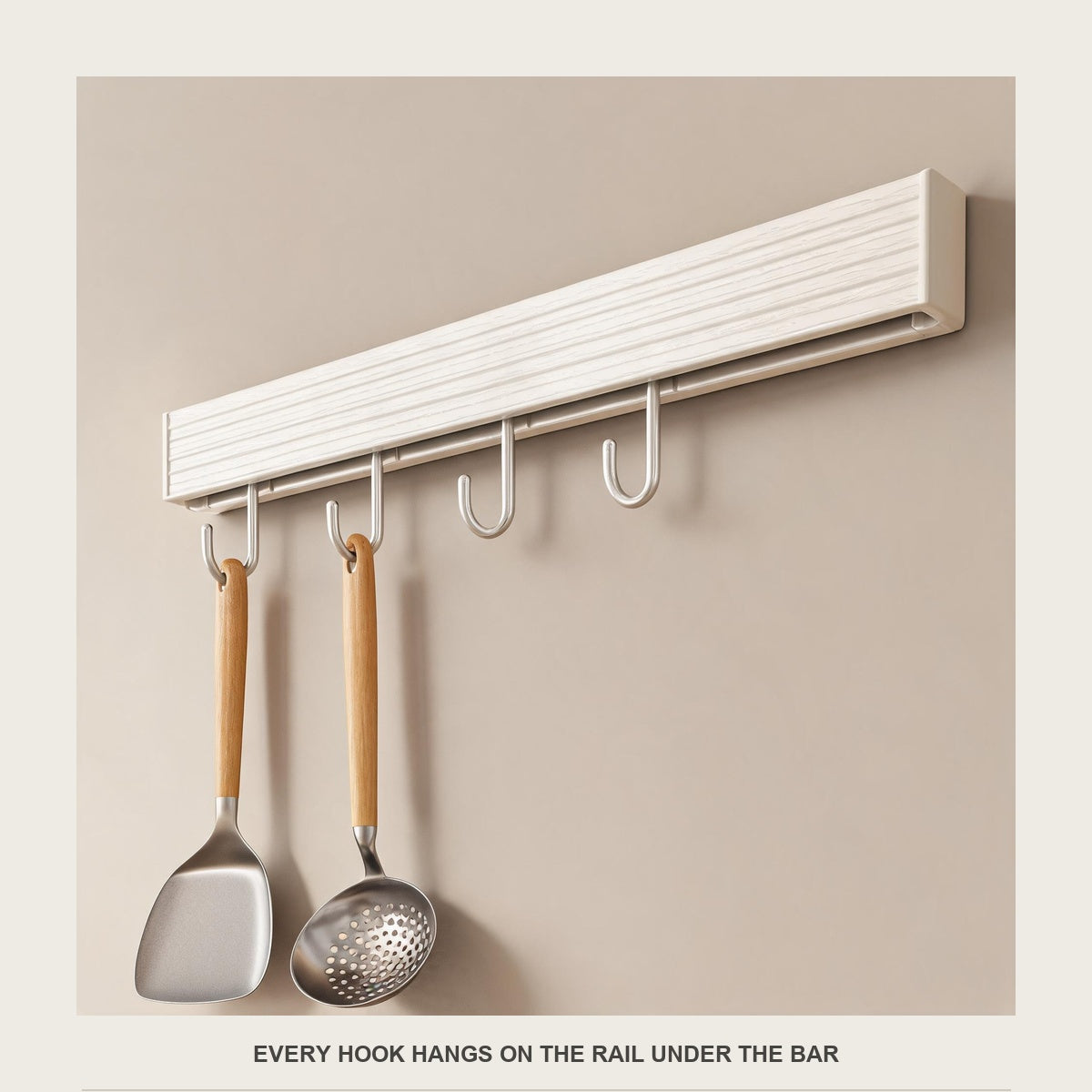 Close-up of slim champagne hooks hanging from the rail under the white bar