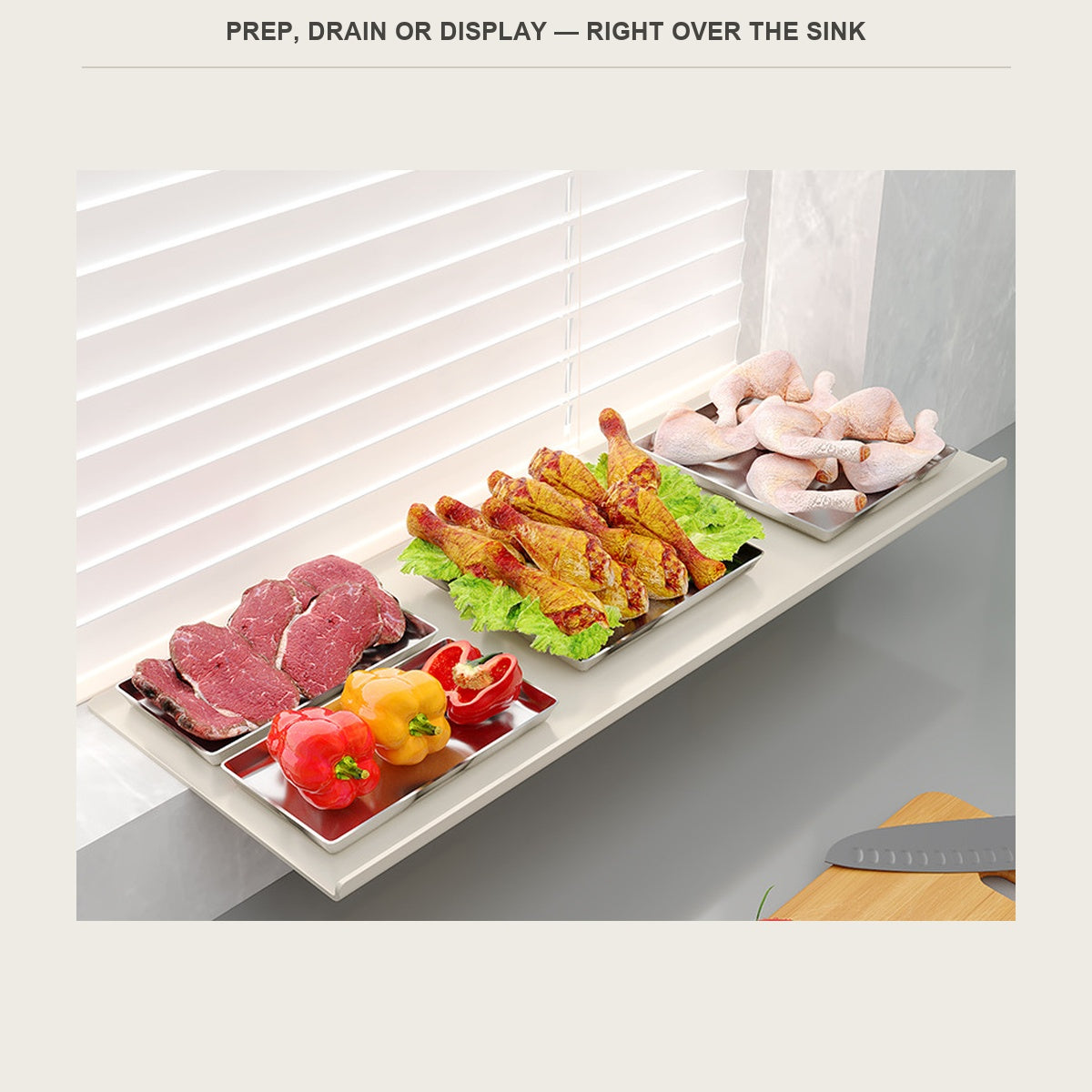 Extension shelf used as prep space over the sink, holding trays of prepped vegetables and meat