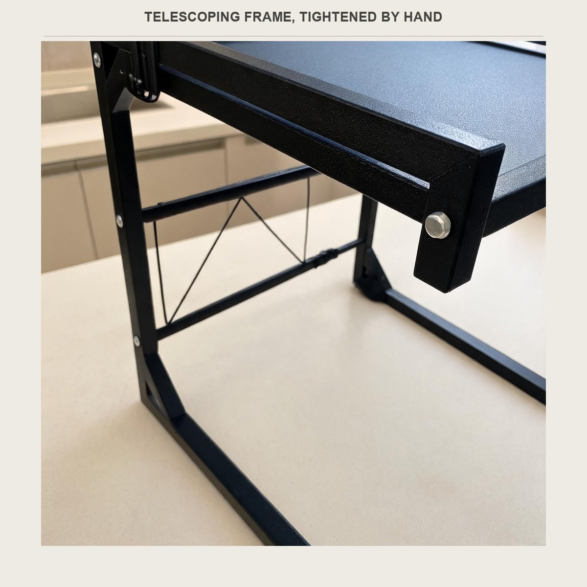 Close-up of the telescoping side frame and the hand-tightened locking bolt