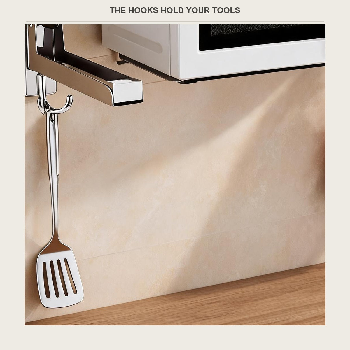 Spatula hanging from the hook under the microwave bracket arm