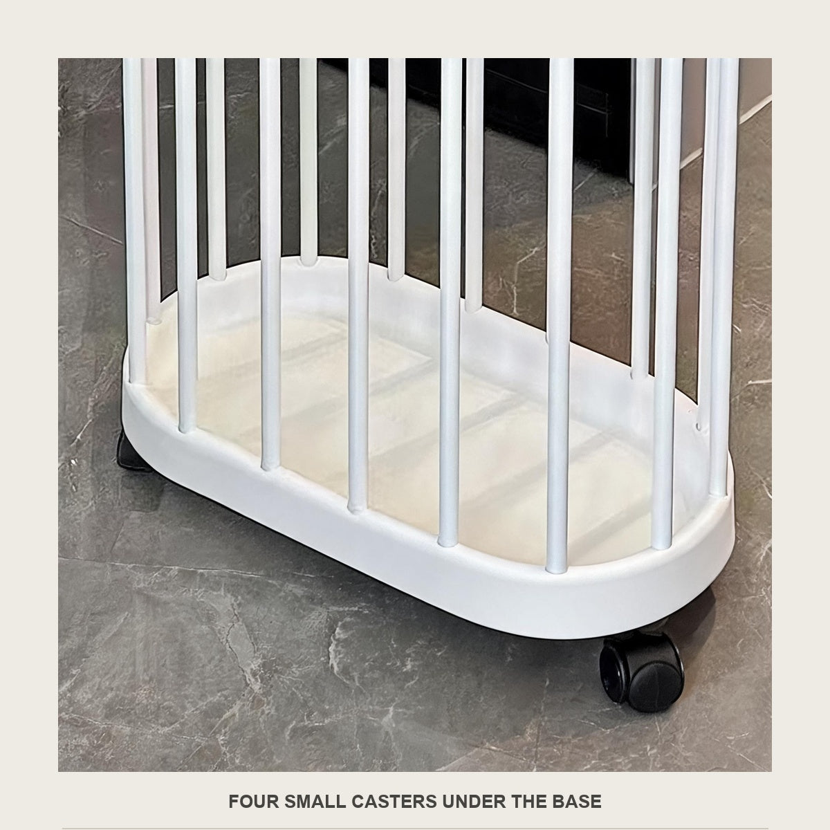 Close-up of the base and slats of the cream bin with one black caster on the tile