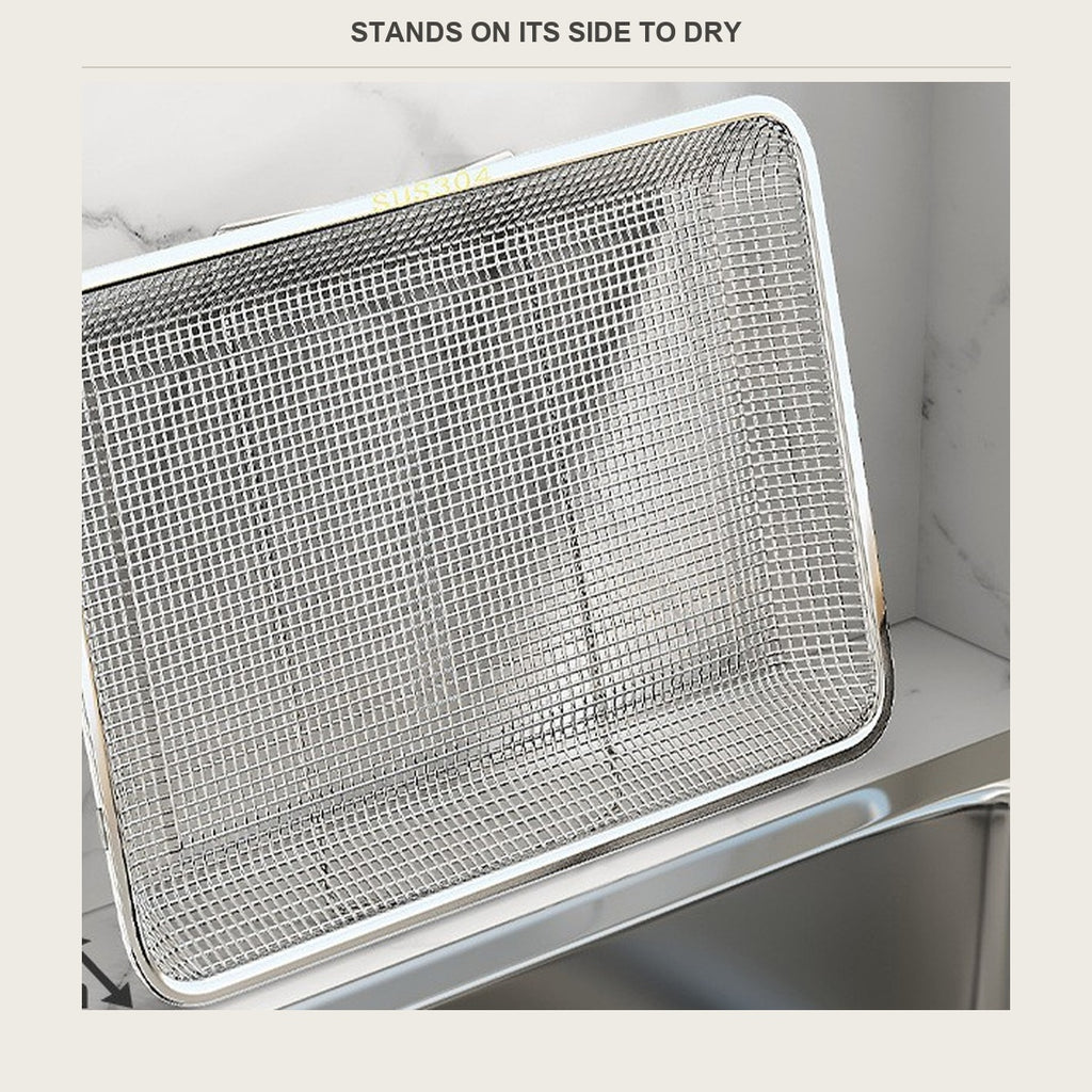 The basket standing on its side to dry beside a sink