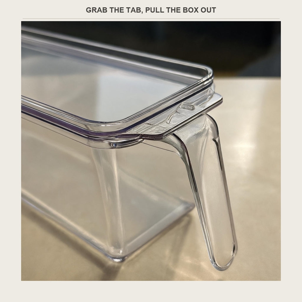 Close-up of the tab handle and the lid rim on the clear fridge bin