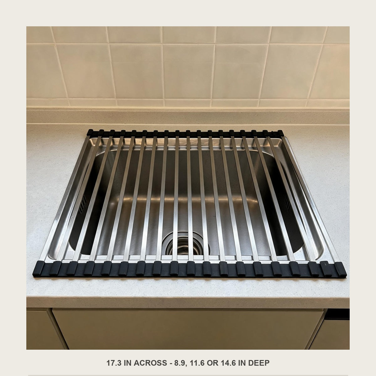 Front view of the empty roll-up rack spanning 17.3 inches across the sink