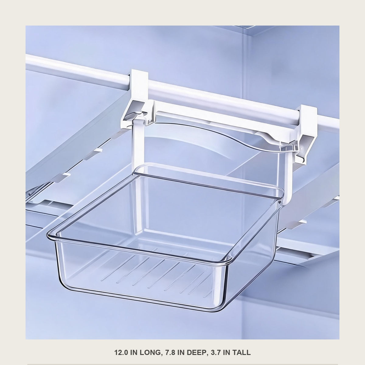 Front view of the empty clear drawer hanging under a fridge shelf with the white rail above it