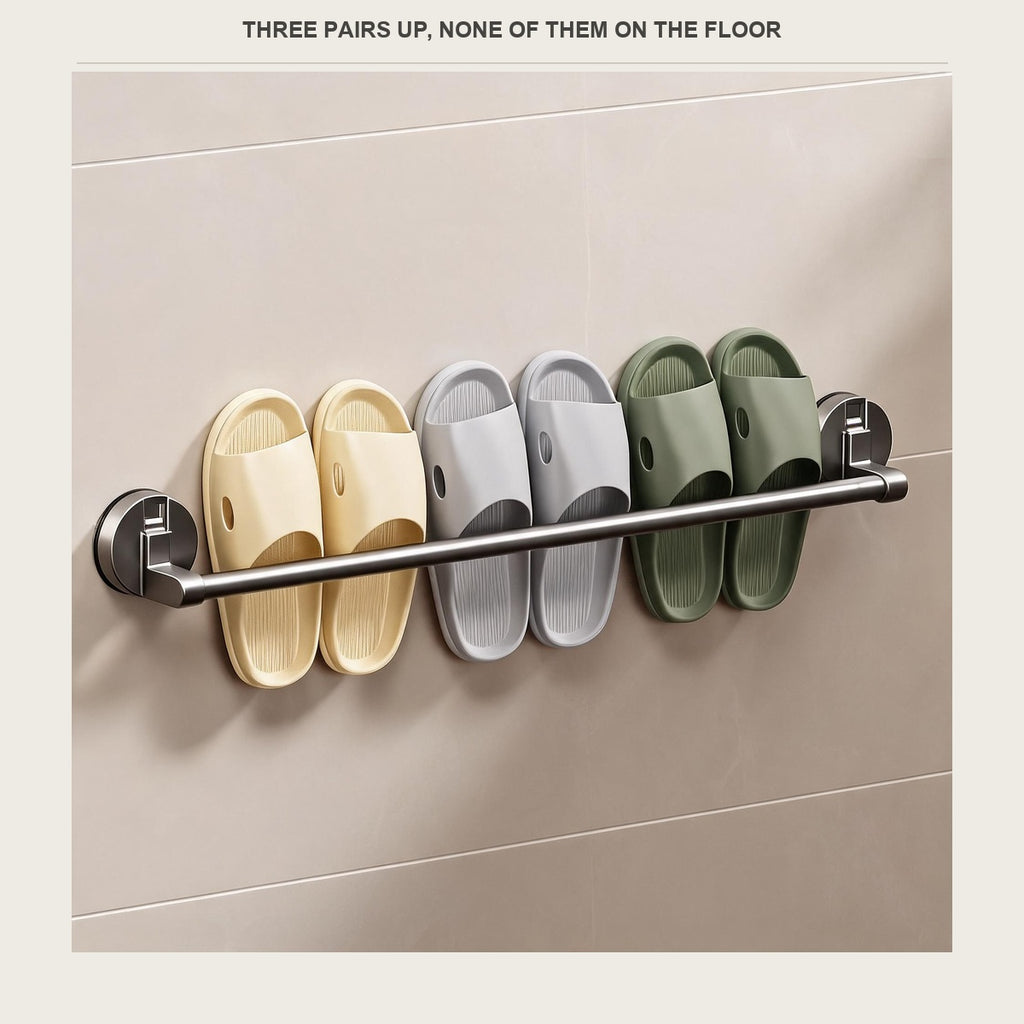 Three pairs of slippers lined up on the bar, all off the floor