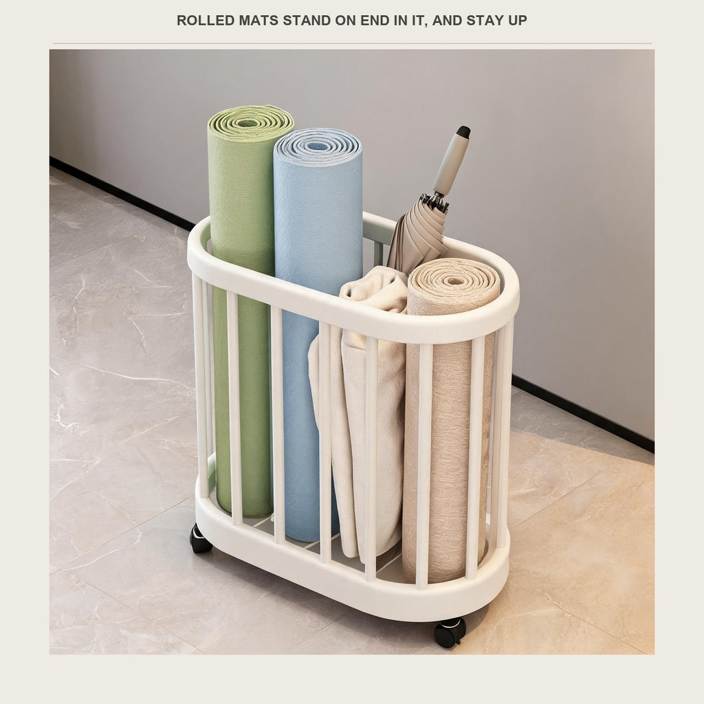 The rolling bin full of rolled mats, towels and a closed umbrella standing on end