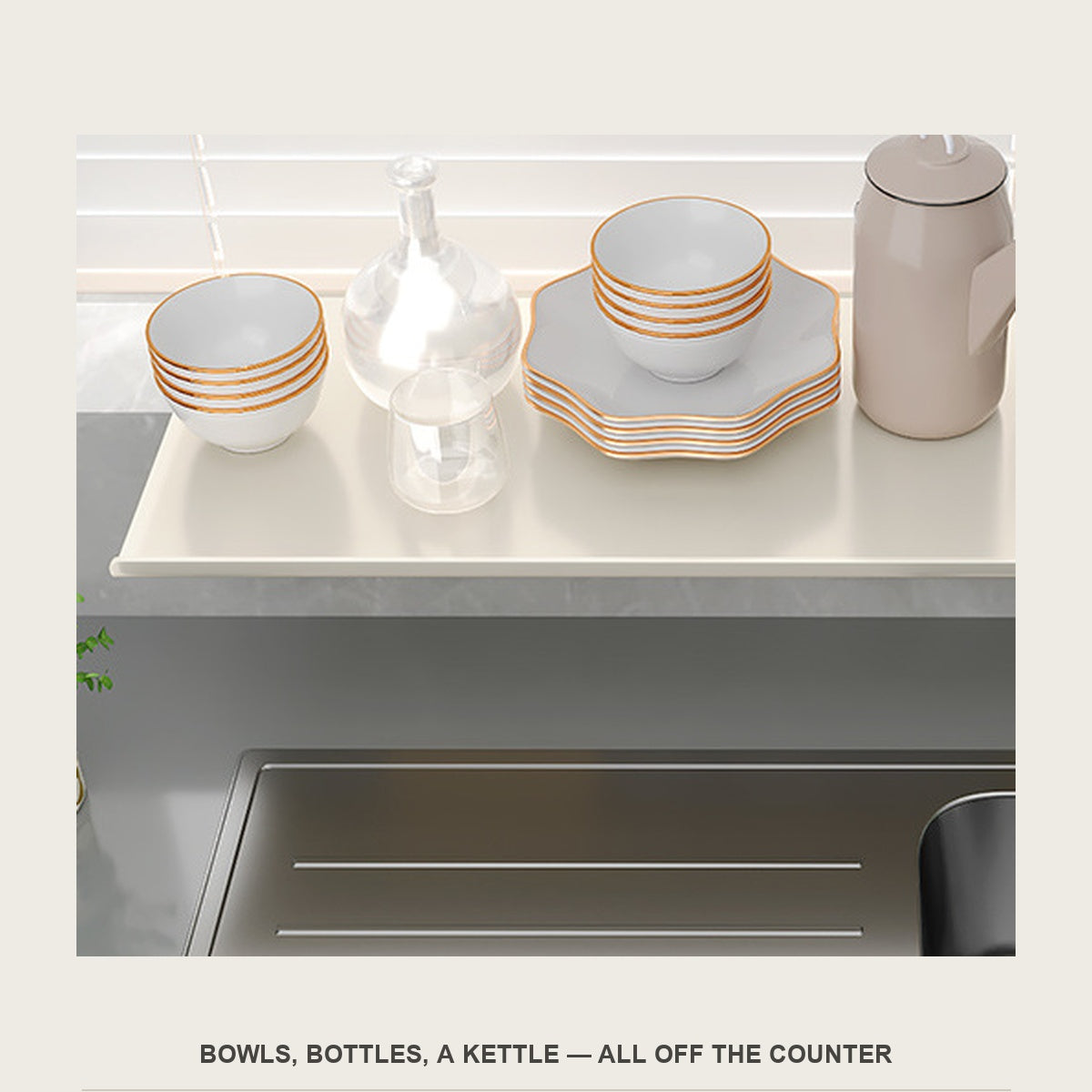 Close view of bowls, a glass carafe and a kettle standing on the sill extension shelf