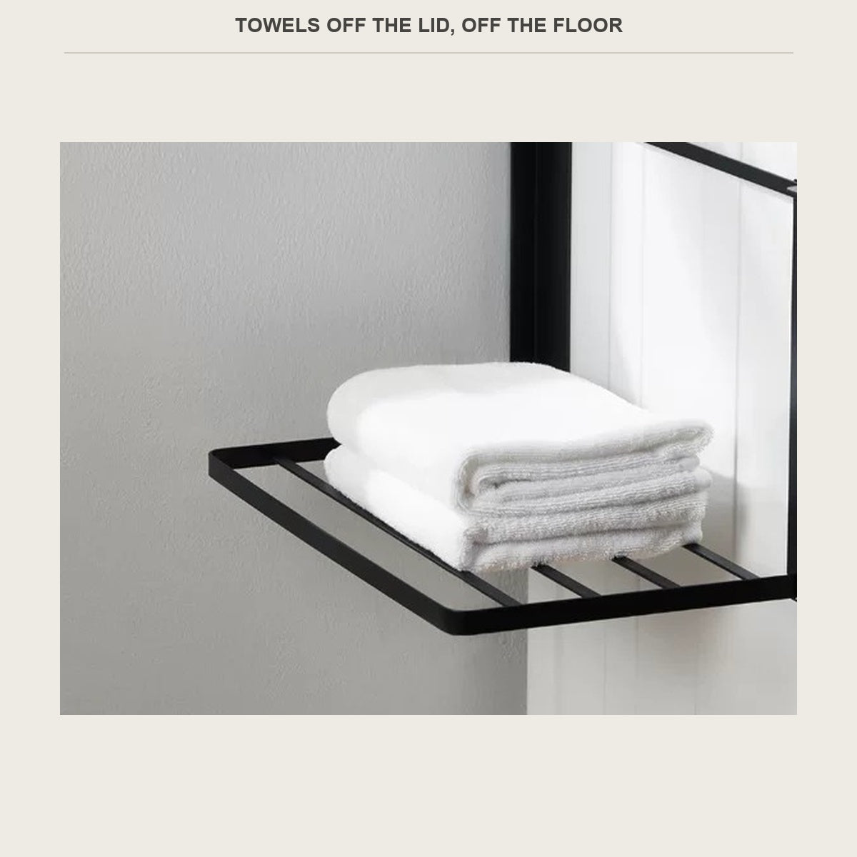 Folded towels sitting on the slatted shelf, off the top of the machine