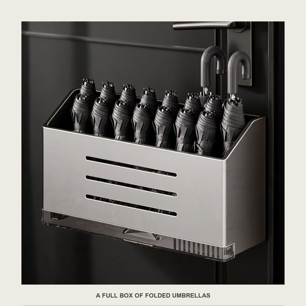 The drip-tray box packed with folded umbrellas standing upright, handles up