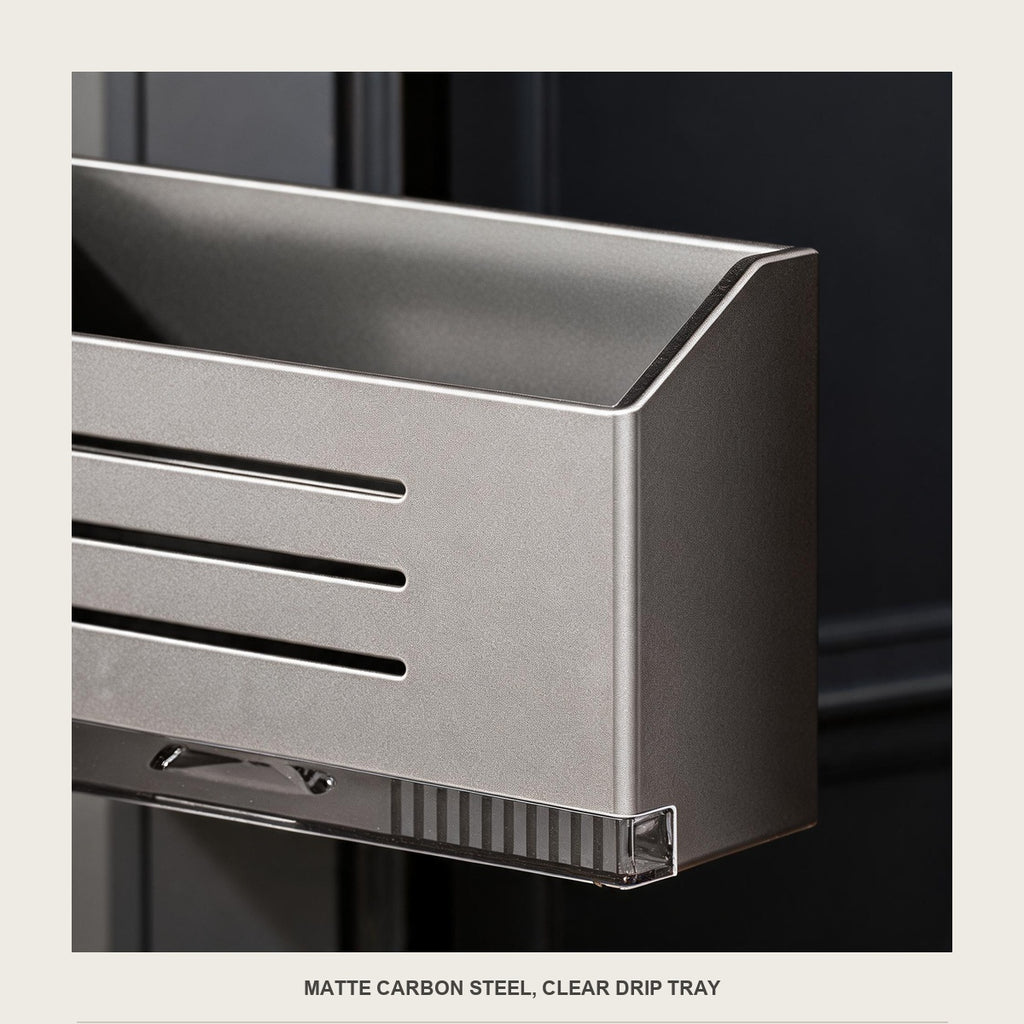 Macro of the drainage slots on the front of the carbon steel umbrella box and its clear tray