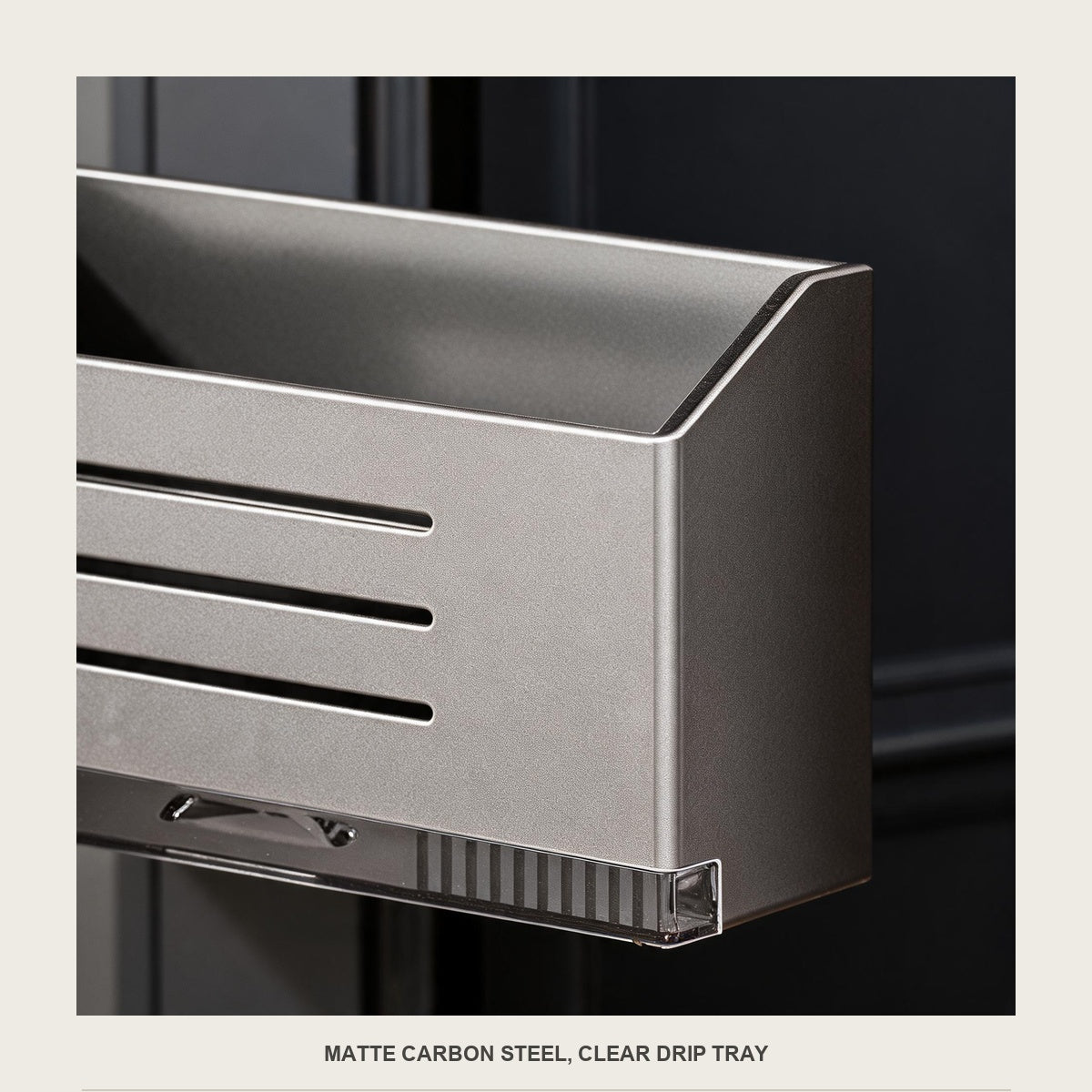 Macro of the drainage slots on the front of the carbon steel umbrella box and its clear tray