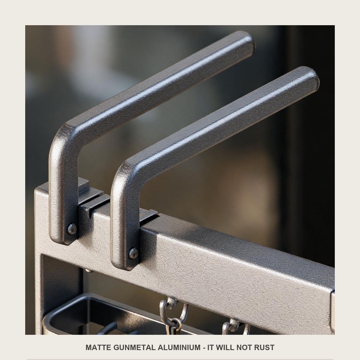 Macro of the matte gunmetal aluminium arm, hinge and rivets