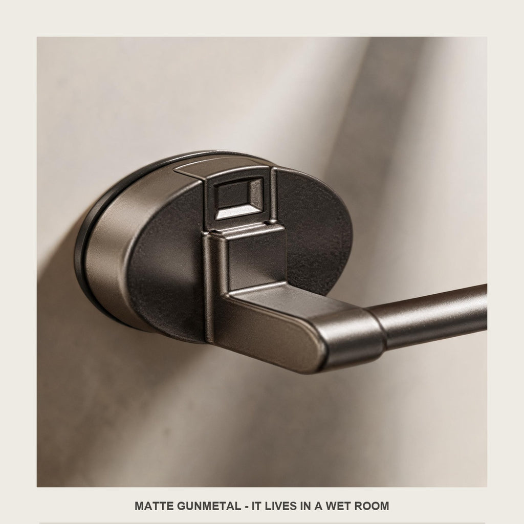 Macro of the matte gunmetal bar where it meets the round suction pad