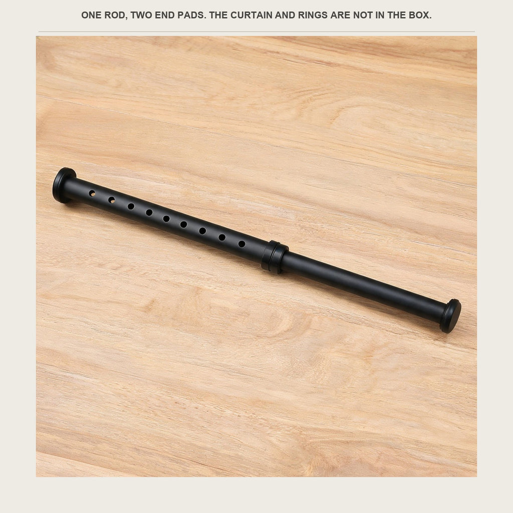The tension rod lying on a pale wood counter with its end pads