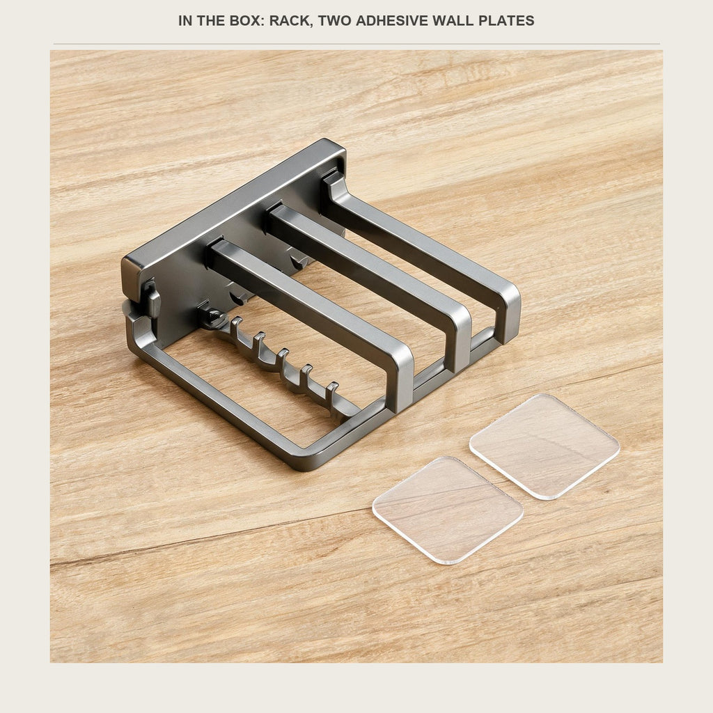 The rack with two clear adhesive wall plates laid out beside it