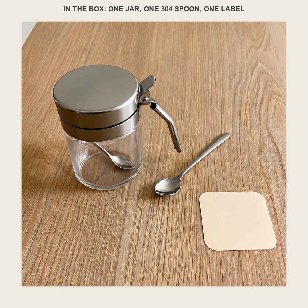 The jar with the stainless spoon and the blank label sticker