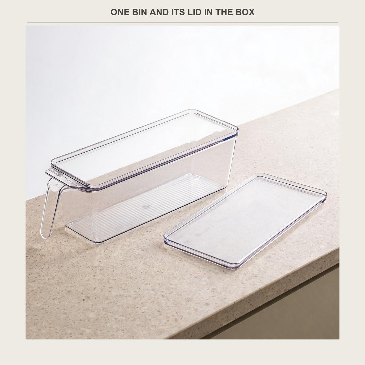 The bin with its lid taken off and laid beside it on the counter