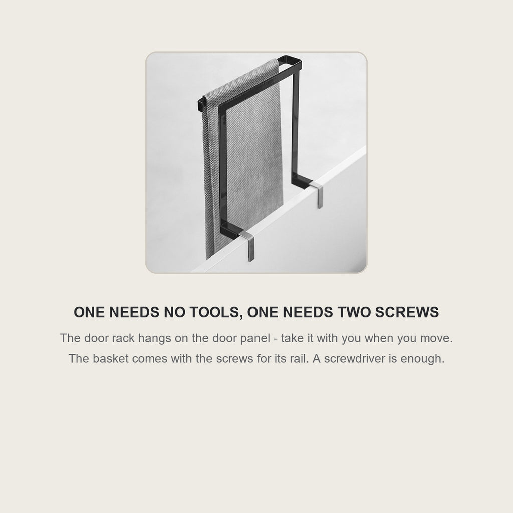 The door rack hanging on a cabinet door with a dish towel