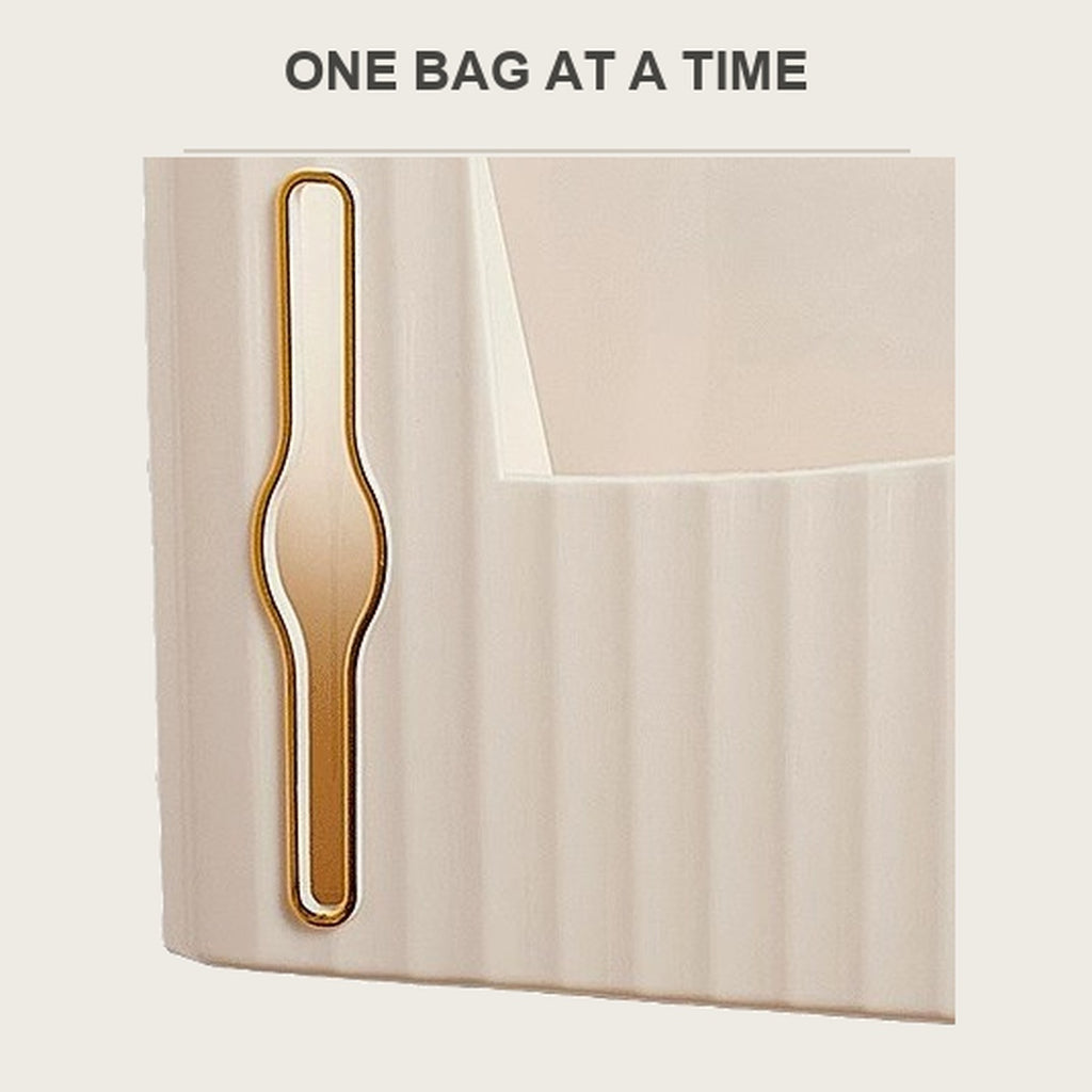 Detail of the front slot where a bag comes out of the caddy