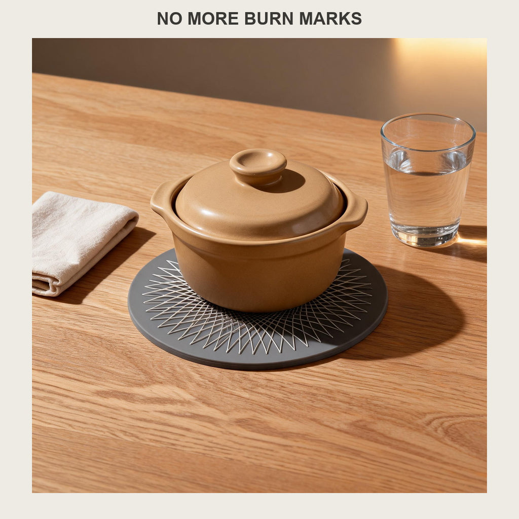 Round silicone trivet mat under a ceramic casserole dish on a light oak dining table