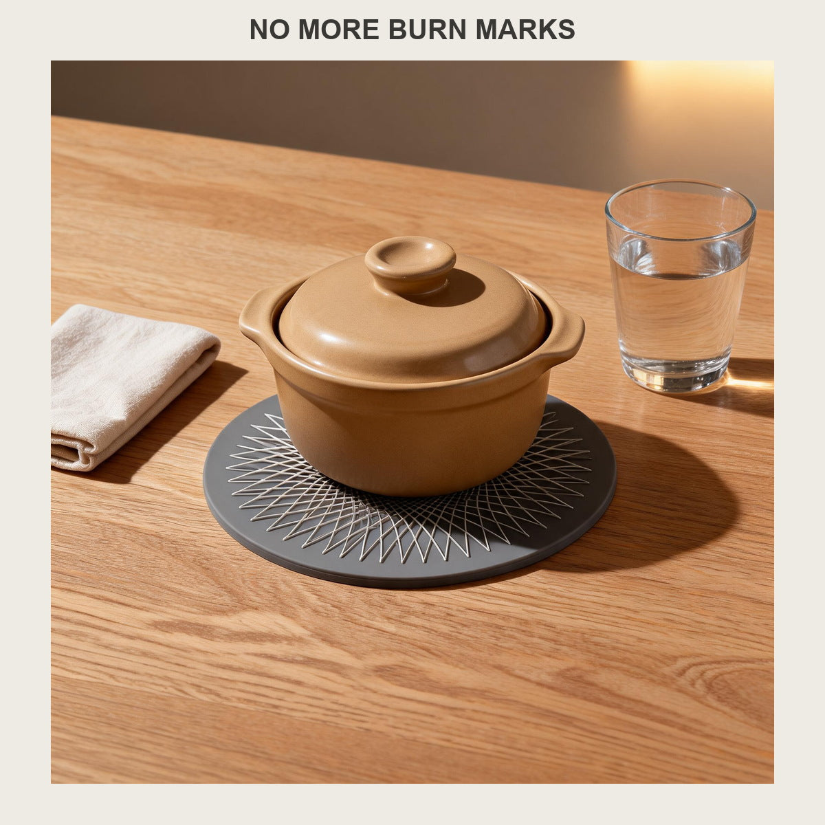 Round silicone trivet mat under a ceramic casserole dish on a light oak dining table