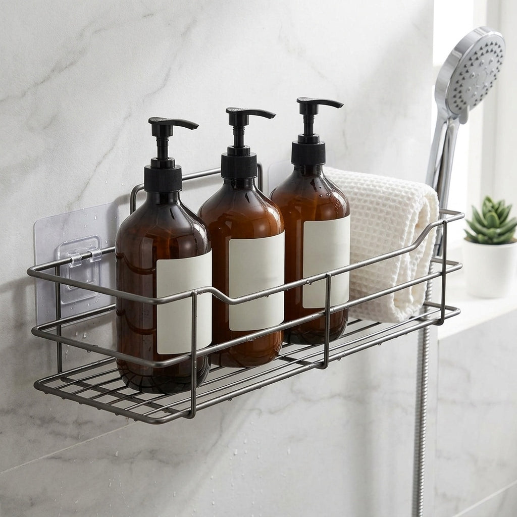 Gun-grey stainless shower caddy flat-lay on a bathroom vanity with folded towels