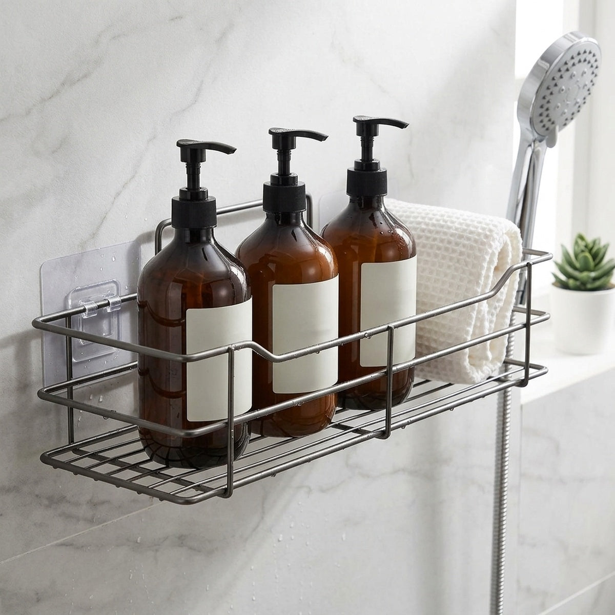Gun-grey stainless shower caddy flat-lay on a bathroom vanity with folded towels