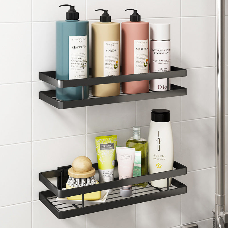 Shower caddy mounted on tile wall next to shower head