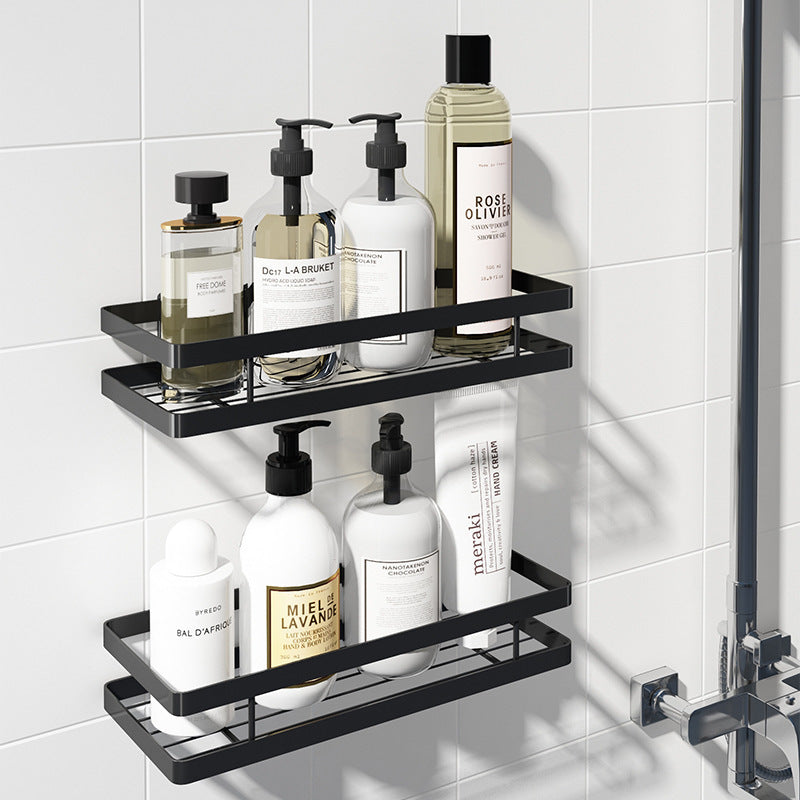 Black steel shower shelf with soap and shampoo bottles