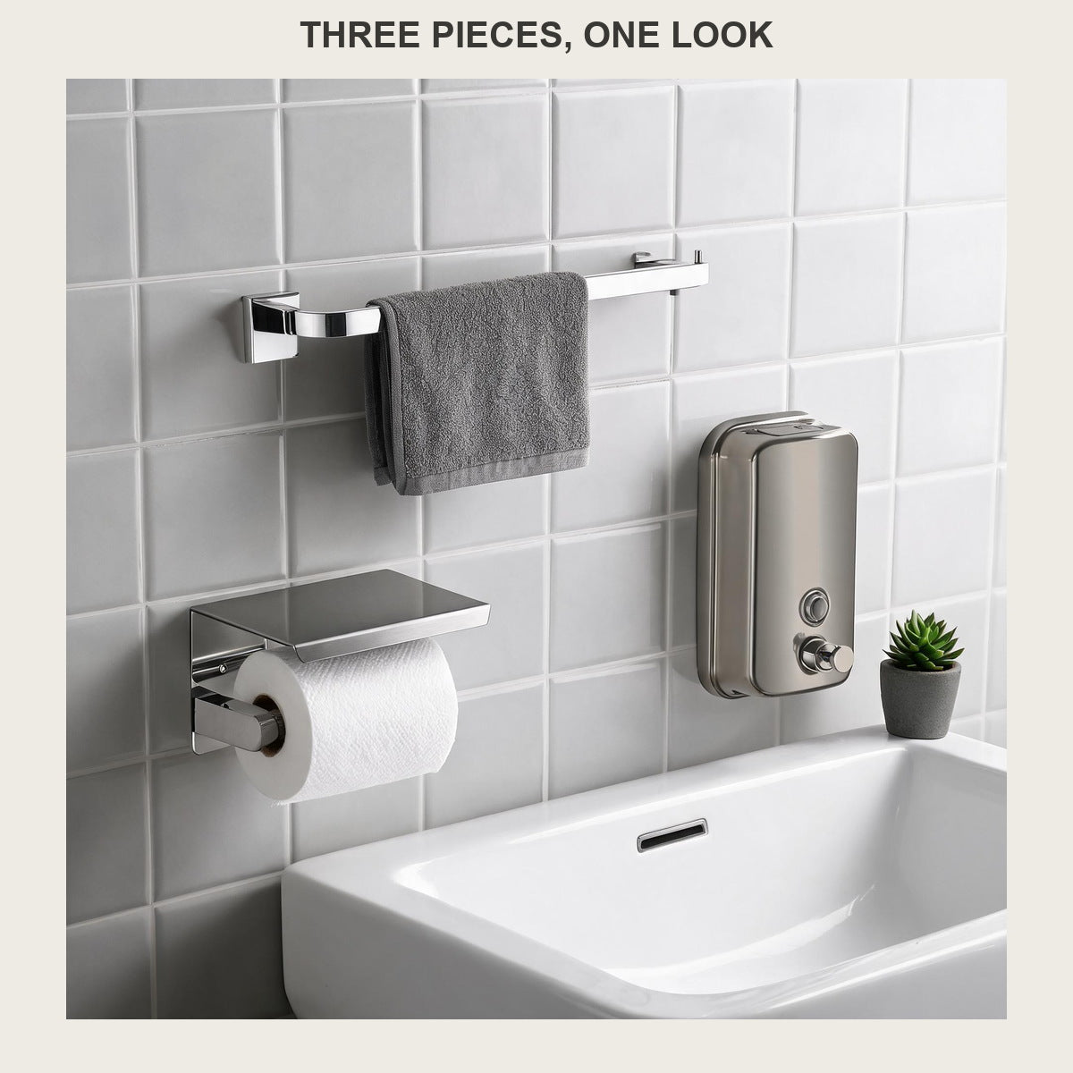 Three-piece brushed stainless bathroom set on a tiled wall: towel bar, paper holder and soap dispenser